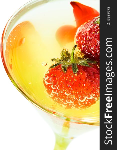 Strawberry with glass of juice isolated