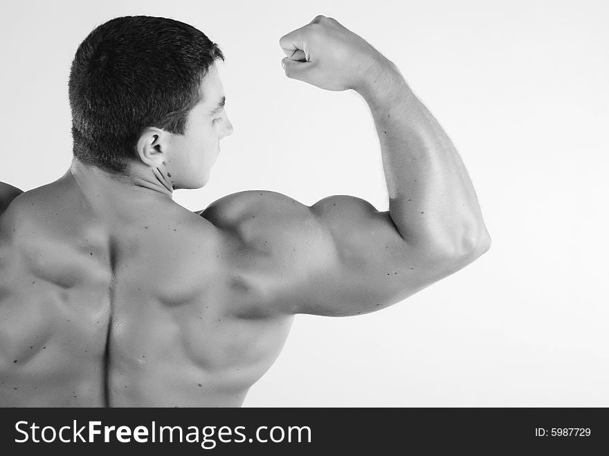 Young man athlete with perfect body at white background. Young man athlete with perfect body at white background