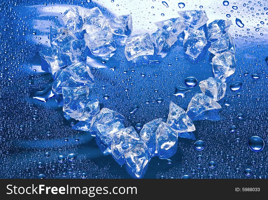 Heart from ice on blue background