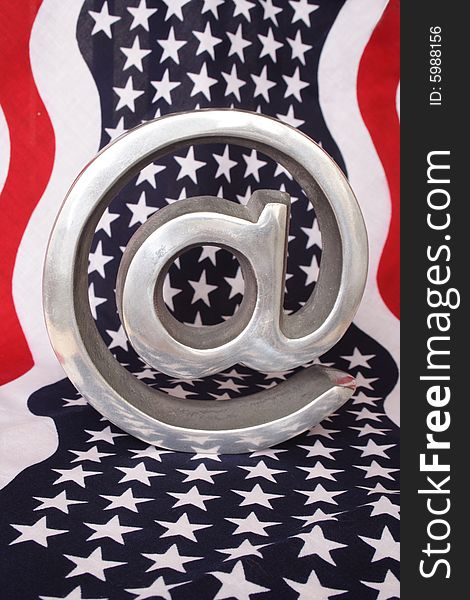 Arroba symbol over the American flag  as background. Arroba symbol over the American flag  as background