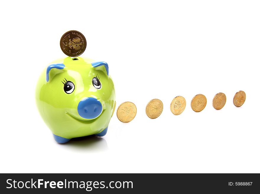 Pottery pig with a few golden coins. Pottery pig with a few golden coins
