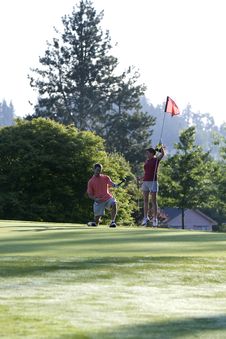 Man And Woman On Golf Course - Vertical Stock Photos