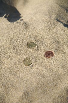 Three Coins At The Beach Royalty Free Stock Image