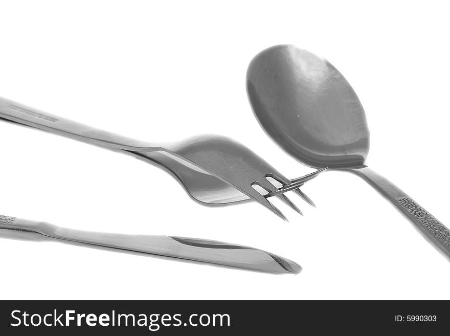 Fork, spoon and knife isolated on white background