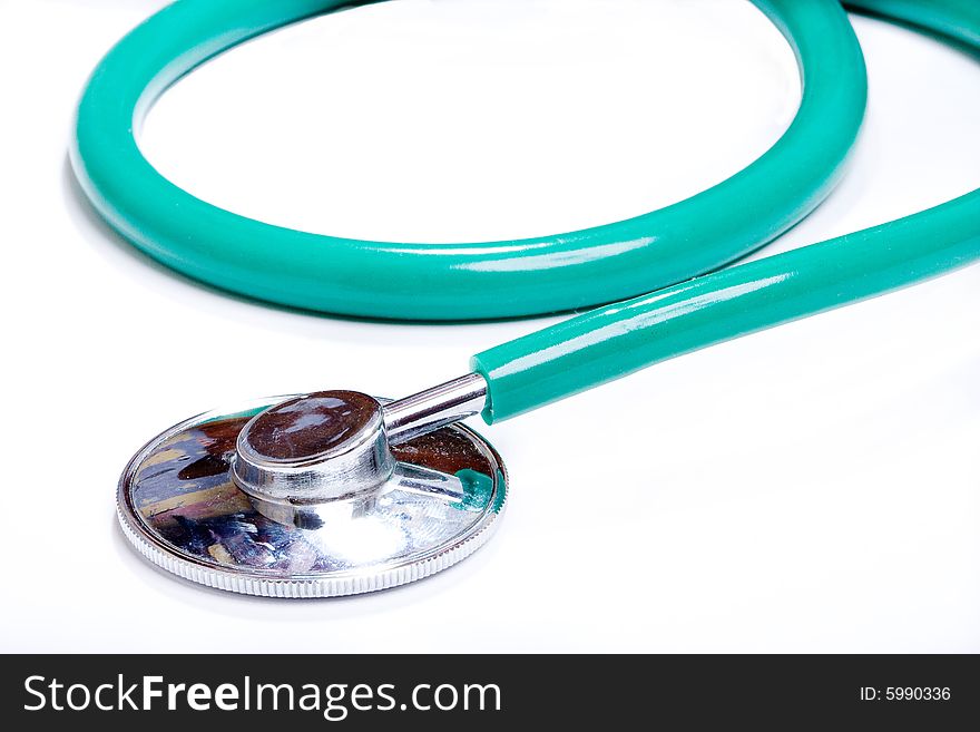 Green stethoscope on a white background