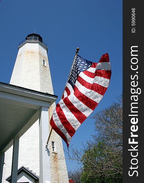 American Flag Hanging by Sandy Hook Lighthouse. American Flag Hanging by Sandy Hook Lighthouse