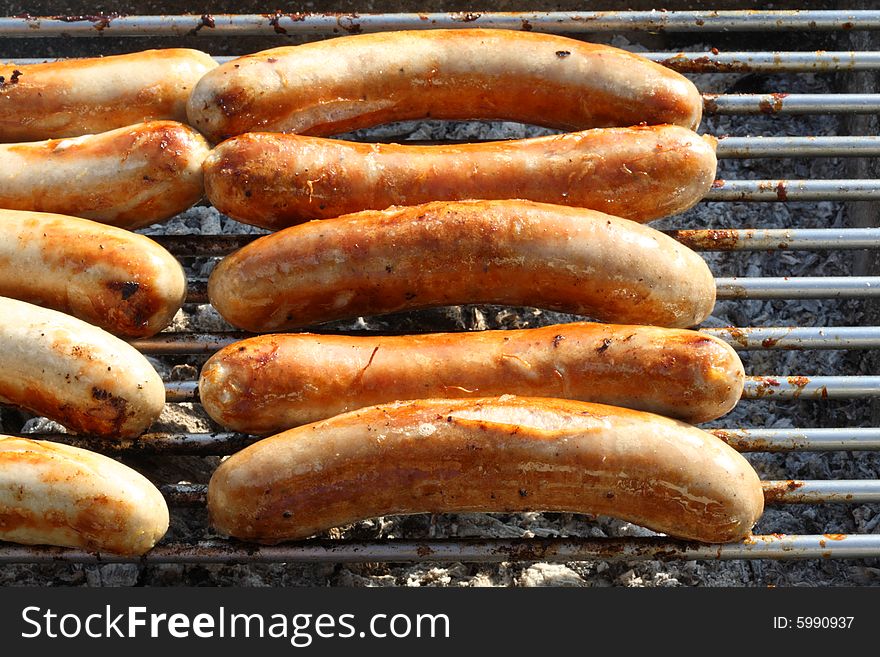 Roasted sausages on the grill. Roasted sausages on the grill.