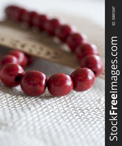 Red wooden beads with a fan. Red wooden beads with a fan