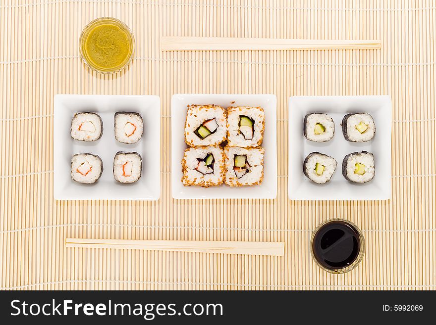 Three plates with different kinds of sushi