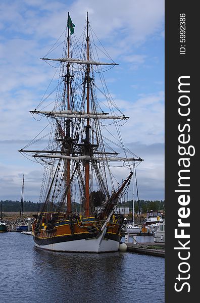 Tall ship moored in a harbor.