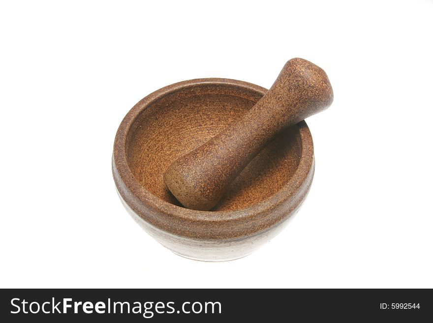 Stoneware pestle and mortar isolated on white
