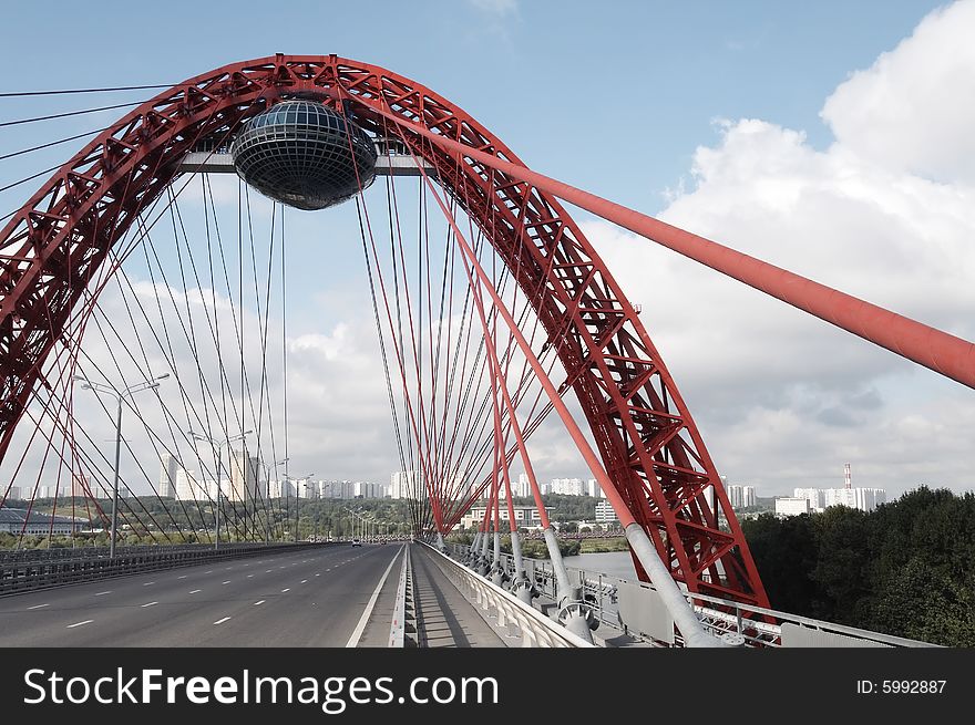 Modern bridge on cloudy background