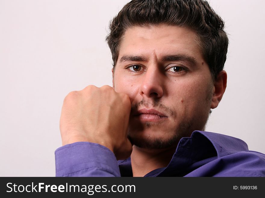 Male model in studio against white wall