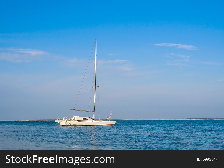 White ship, blue sea, sky and clouds. White ship, blue sea, sky and clouds