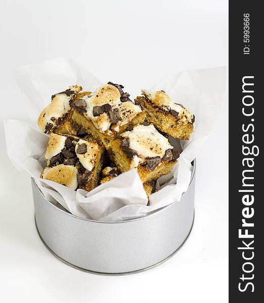 Delicious cakes with creme and chocolate in metal bowl