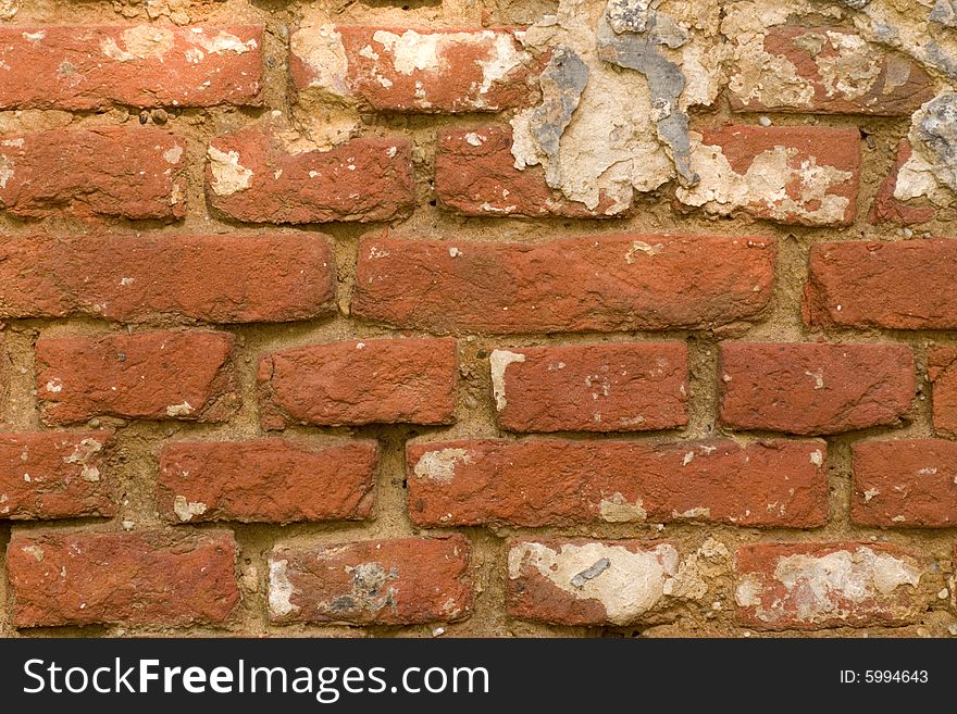 A very grungy red brick wall. A very grungy red brick wall