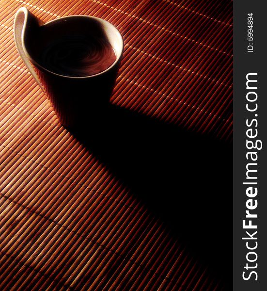 Coffee in the morning on a bamboo place setting.