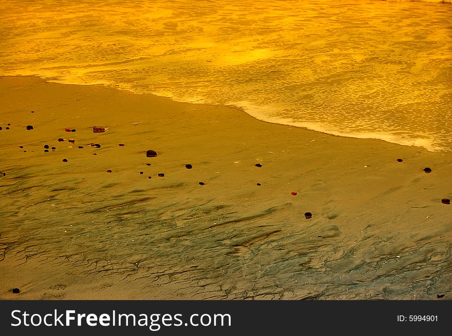 Beach shore at the dim light of the sunset. Beach shore at the dim light of the sunset