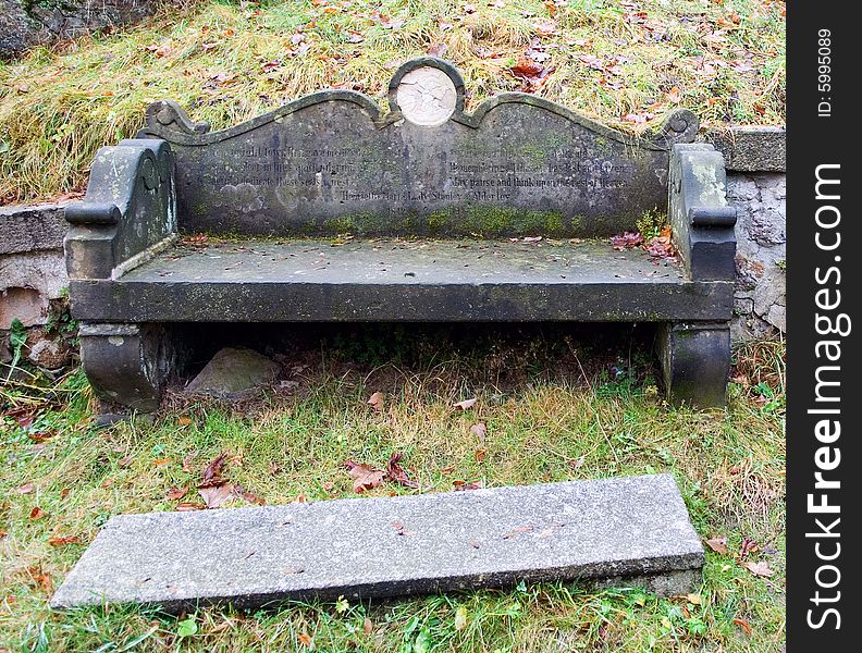 Old inscription on a stone bench