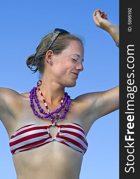 Young lady dancing in bathing suit