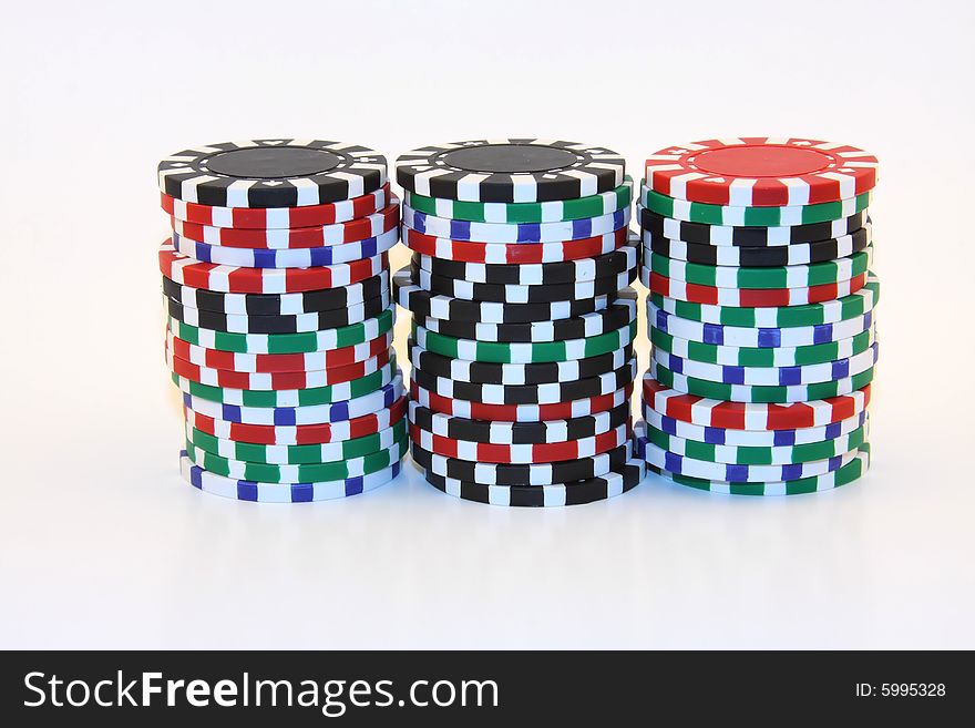 3 stacks of various colors of gambling chips. 3 stacks of various colors of gambling chips.
