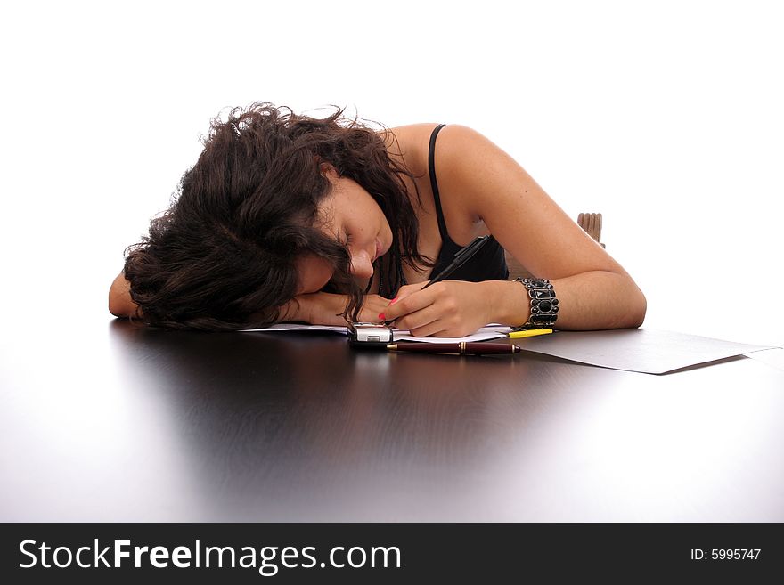 Young business woman sleeping on the desk, isolated in white background