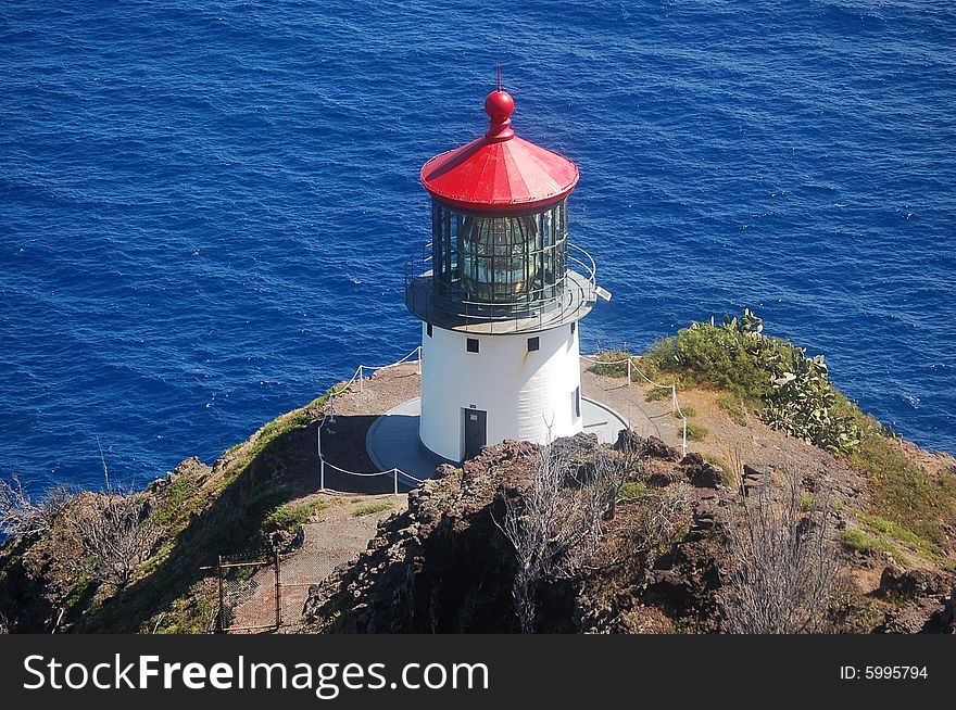 Lighthouse overlooking hawaiis coast a safe haven for all ships