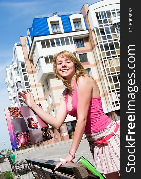 Happy girl with shopping bags outdoor