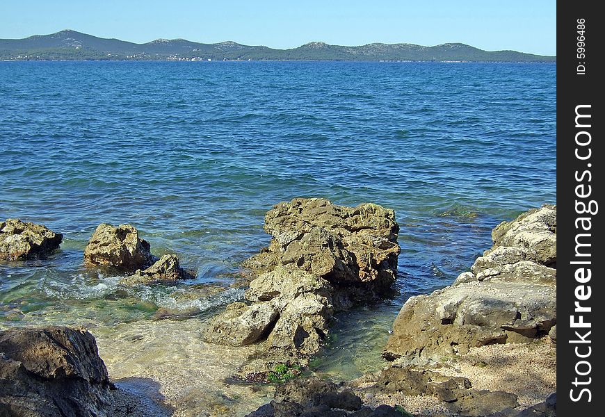 Erosion formed rocks at Croatia resort's coast line. Erosion formed rocks at Croatia resort's coast line