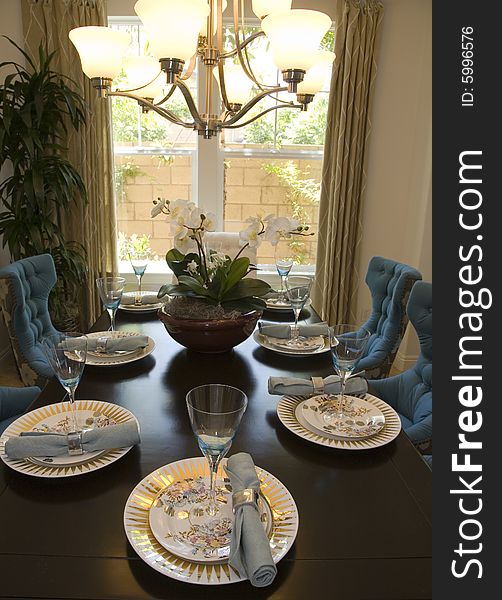 Dining room with modern tableware and decor. Dining room with modern tableware and decor.