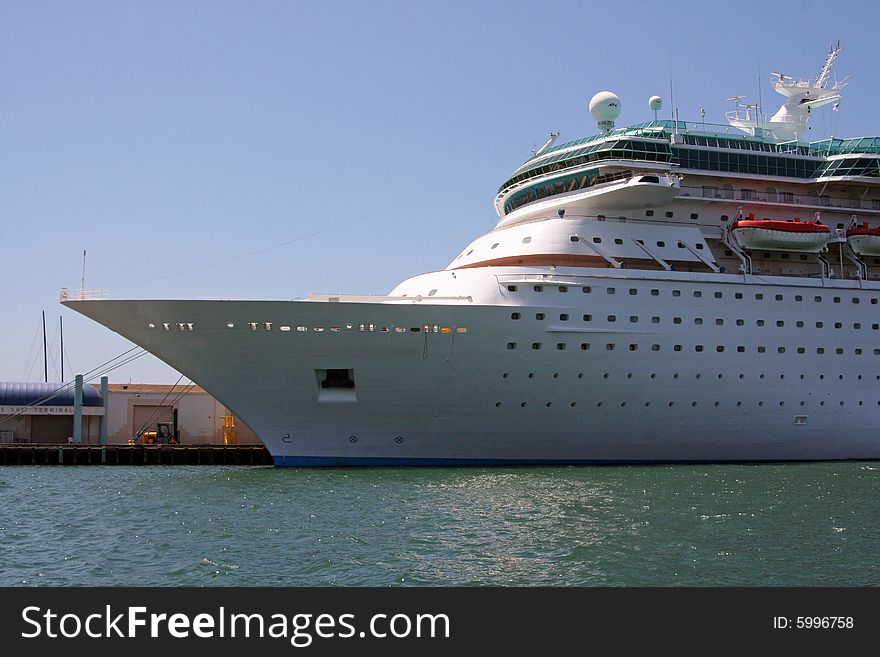 A big cruise ship is docked at the bay in San Diego, California.