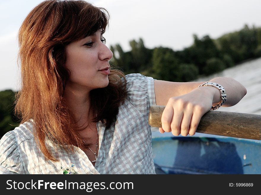 Girl Rowing A Boat