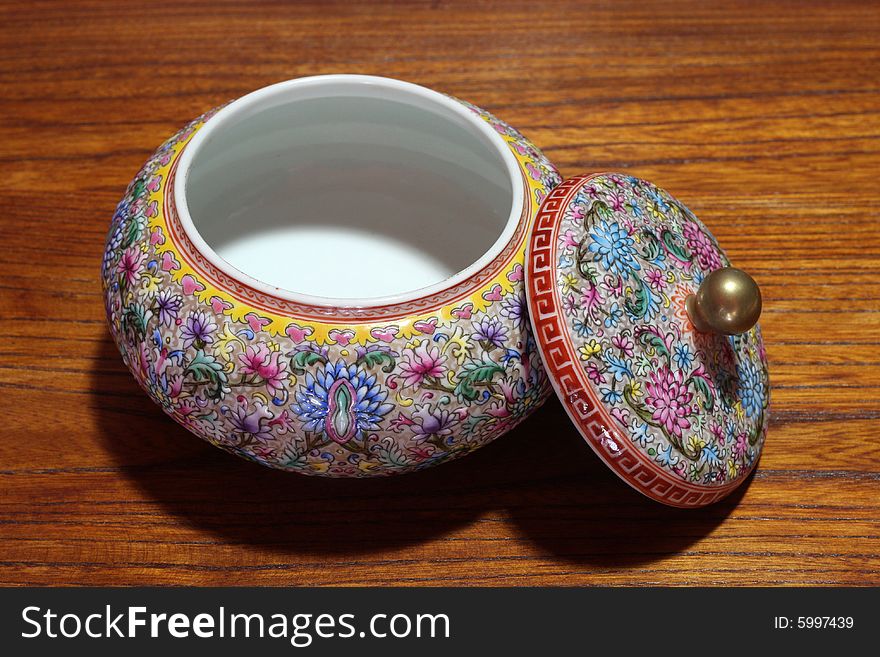 China jar on wood background.