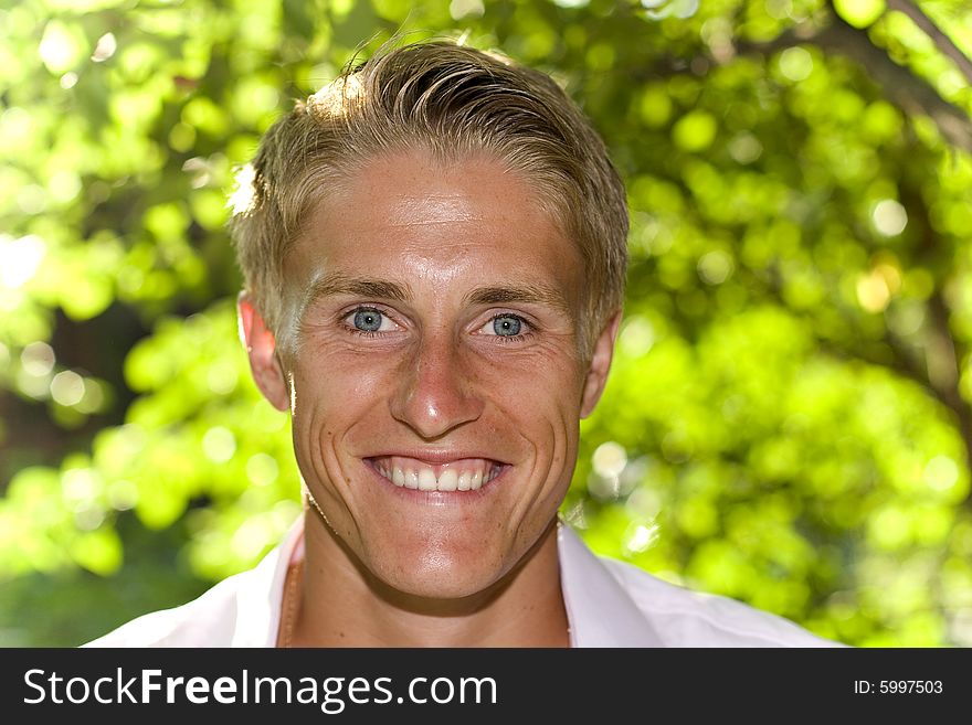 Happy Young Man In A Park