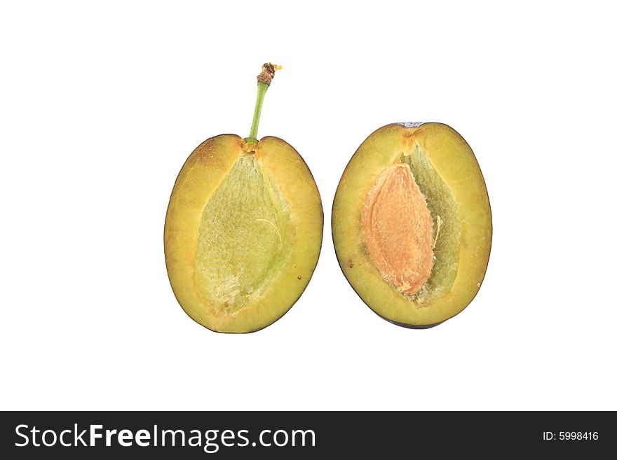 Two halves of plum isolated on white