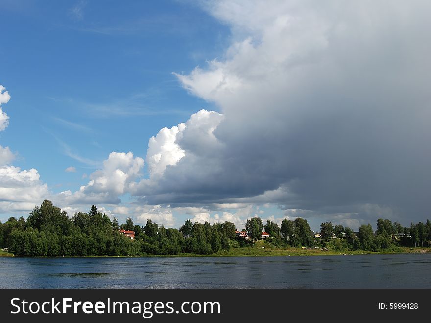 River, sky, idylic non-urban landscape in Swedish north. River, sky, idylic non-urban landscape in Swedish north