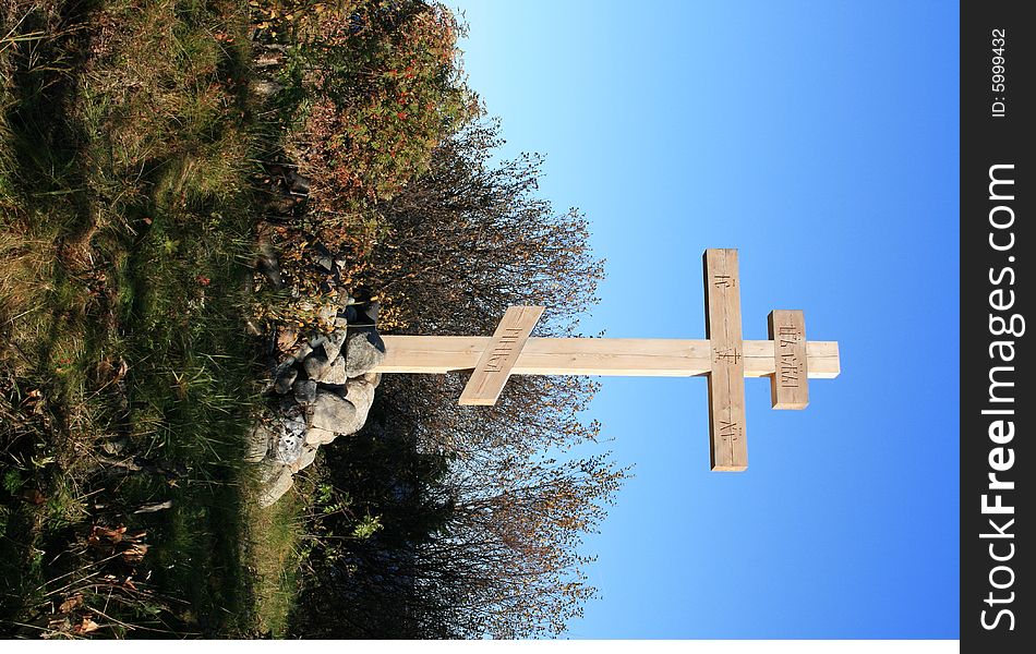 Grave with cross and stone