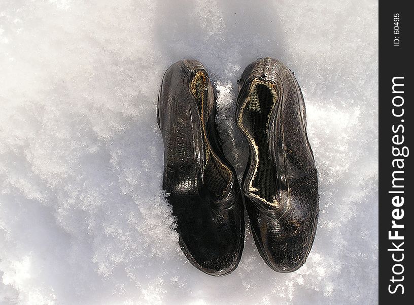 Vintage miniatures raining shoes on snow -closeup picture. Vintage miniatures raining shoes on snow -closeup picture