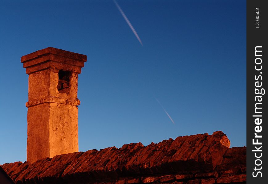 Old brick chimney in the night sky