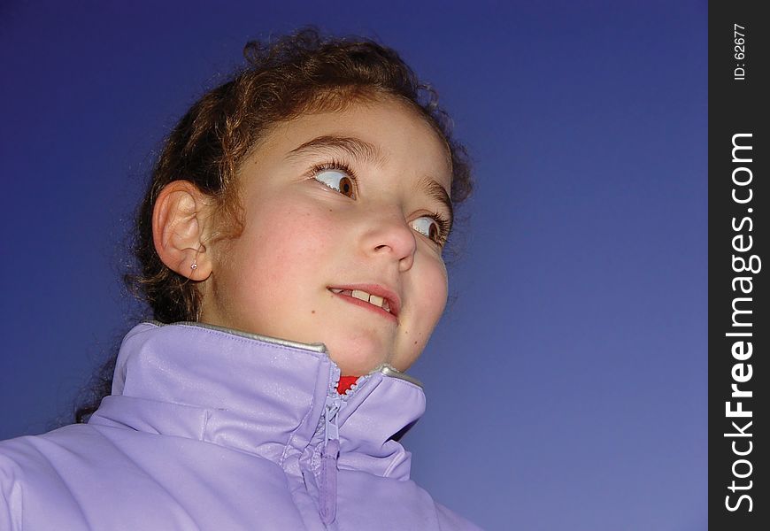 Cute girl against the sky