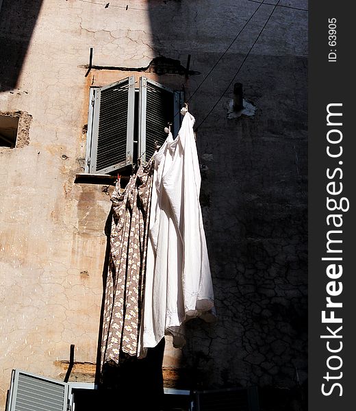 Washed sheets out of the window. Rome, Italy