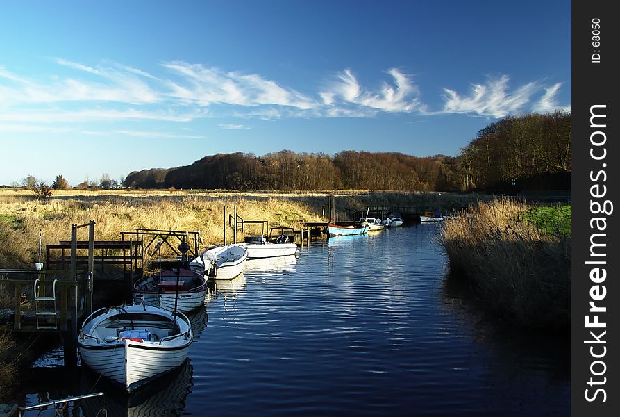 angling boats in a fjord side channel. angling boats in a fjord side channel