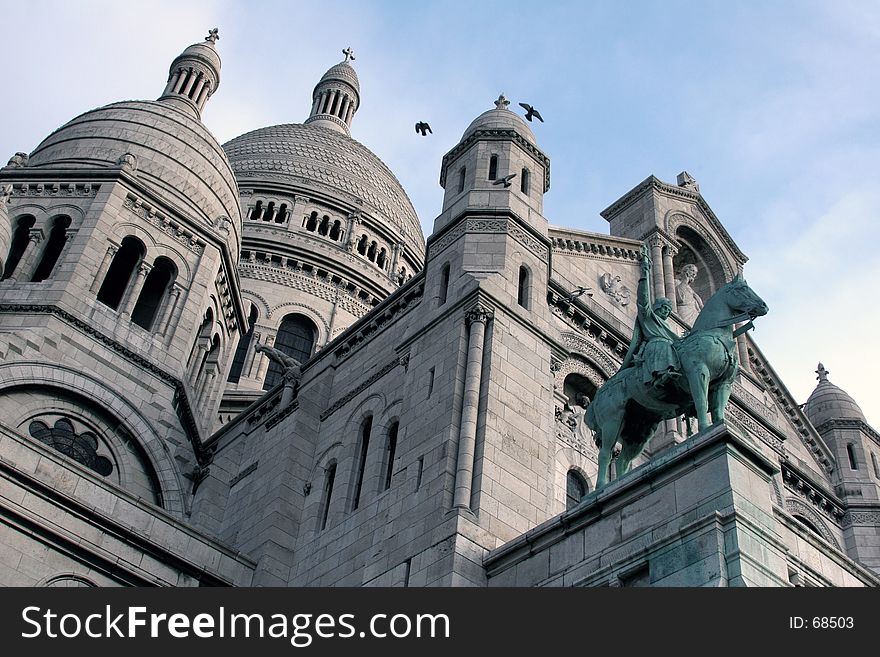 Built on the Montmartre hill the Roman-Byzantine basilica of the Sacred Heart. Built on the Montmartre hill the Roman-Byzantine basilica of the Sacred Heart