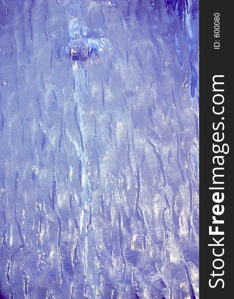 An abstract of rippled plastic toned blue for background. An abstract of rippled plastic toned blue for background
