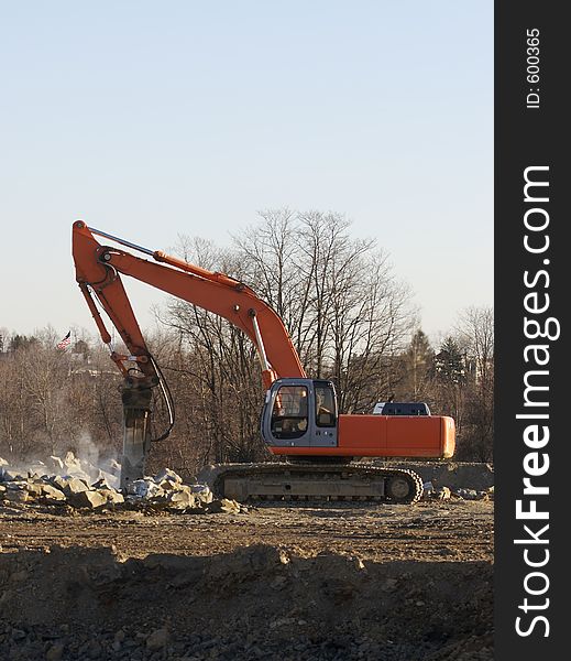 Excavator breaking Rocks