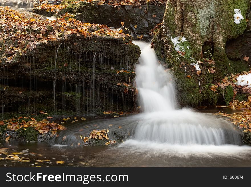 Small waterfall along a brook during a nature hike. Small waterfall along a brook during a nature hike.