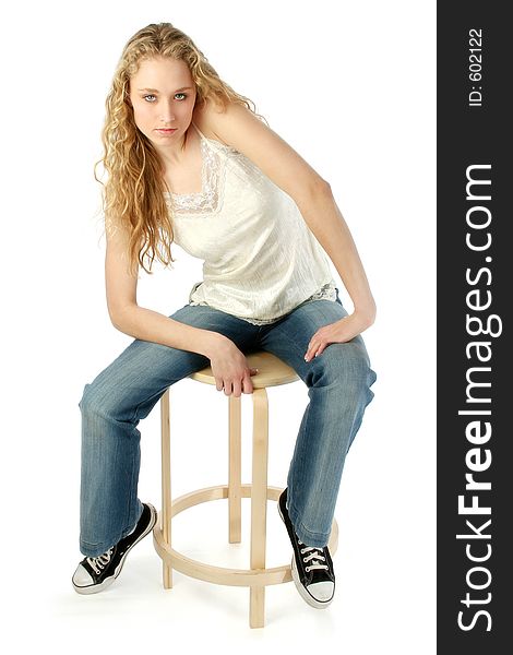 Full body shot of a beautiful blonde model sitting on a stool. Shot with a Canon 20D. Full body shot of a beautiful blonde model sitting on a stool. Shot with a Canon 20D.