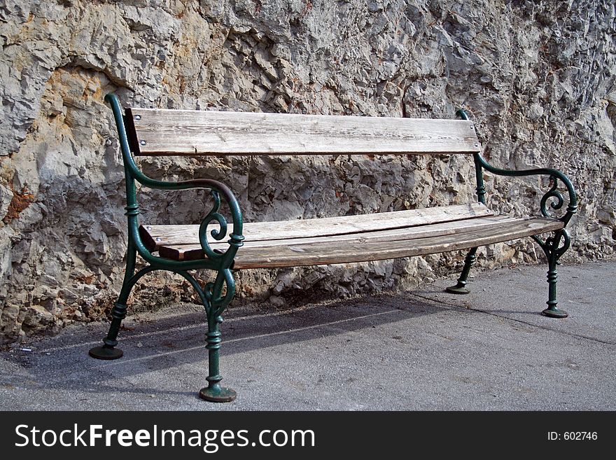 Old bench against rock