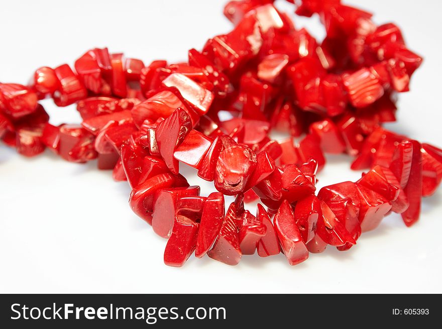 Red necklace with on white