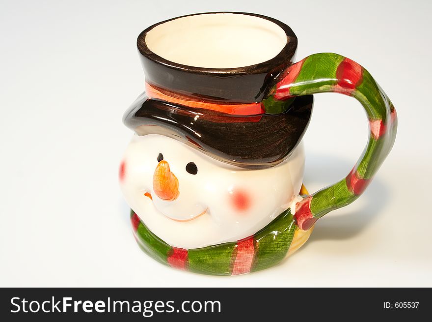 Funny colored cup with snowman face. Funny colored cup with snowman face